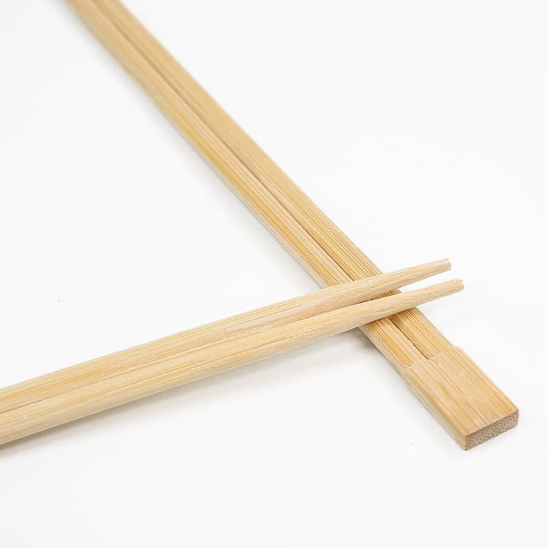 Natural bamboo Twin chopsticks showing the joined end and split tips